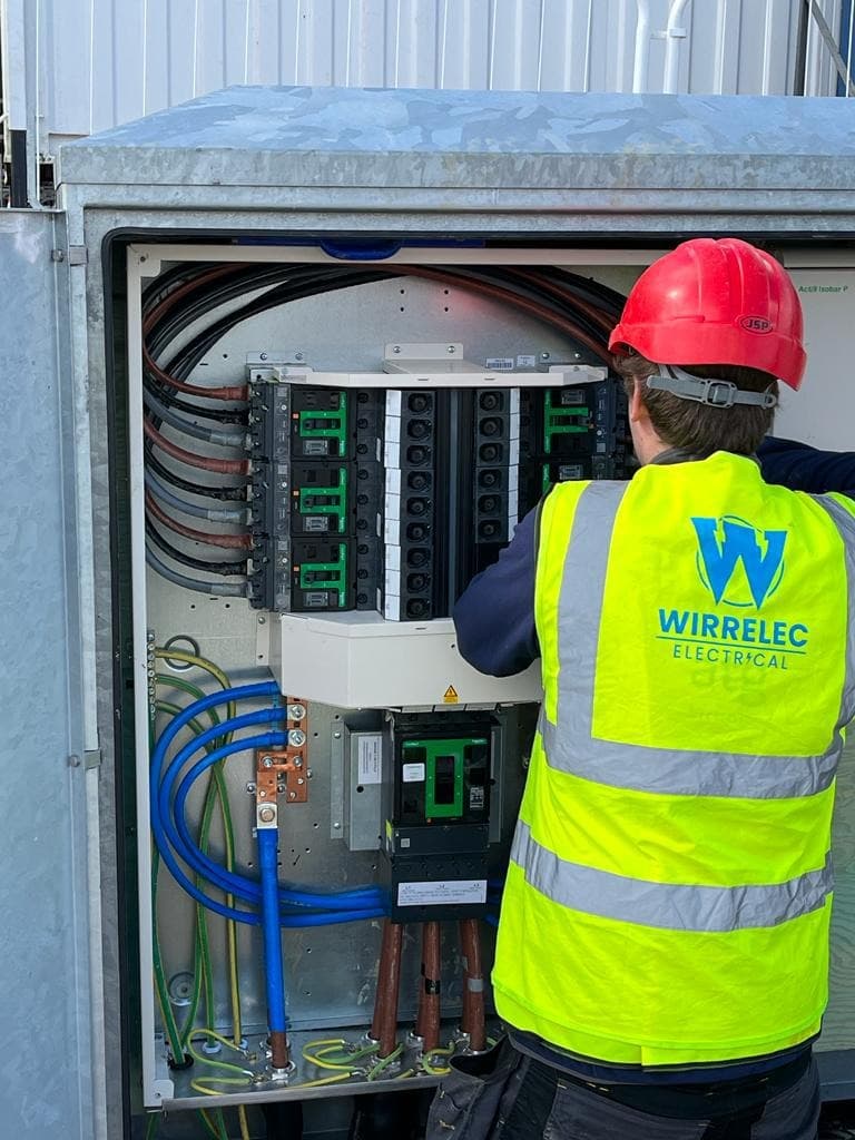 Wirrelec electrician working on a distribution board on the Wirral