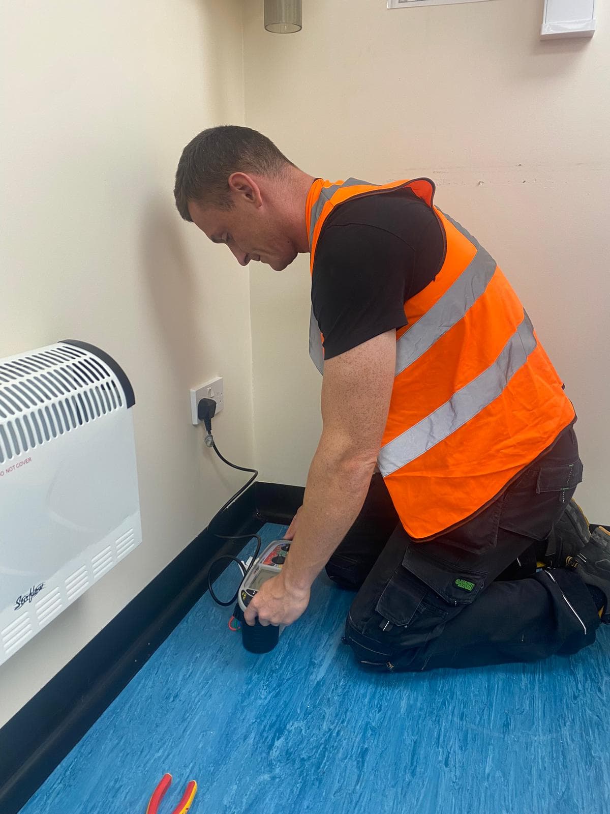 Wirrelec electrician working on a socket in a home on the Wirral