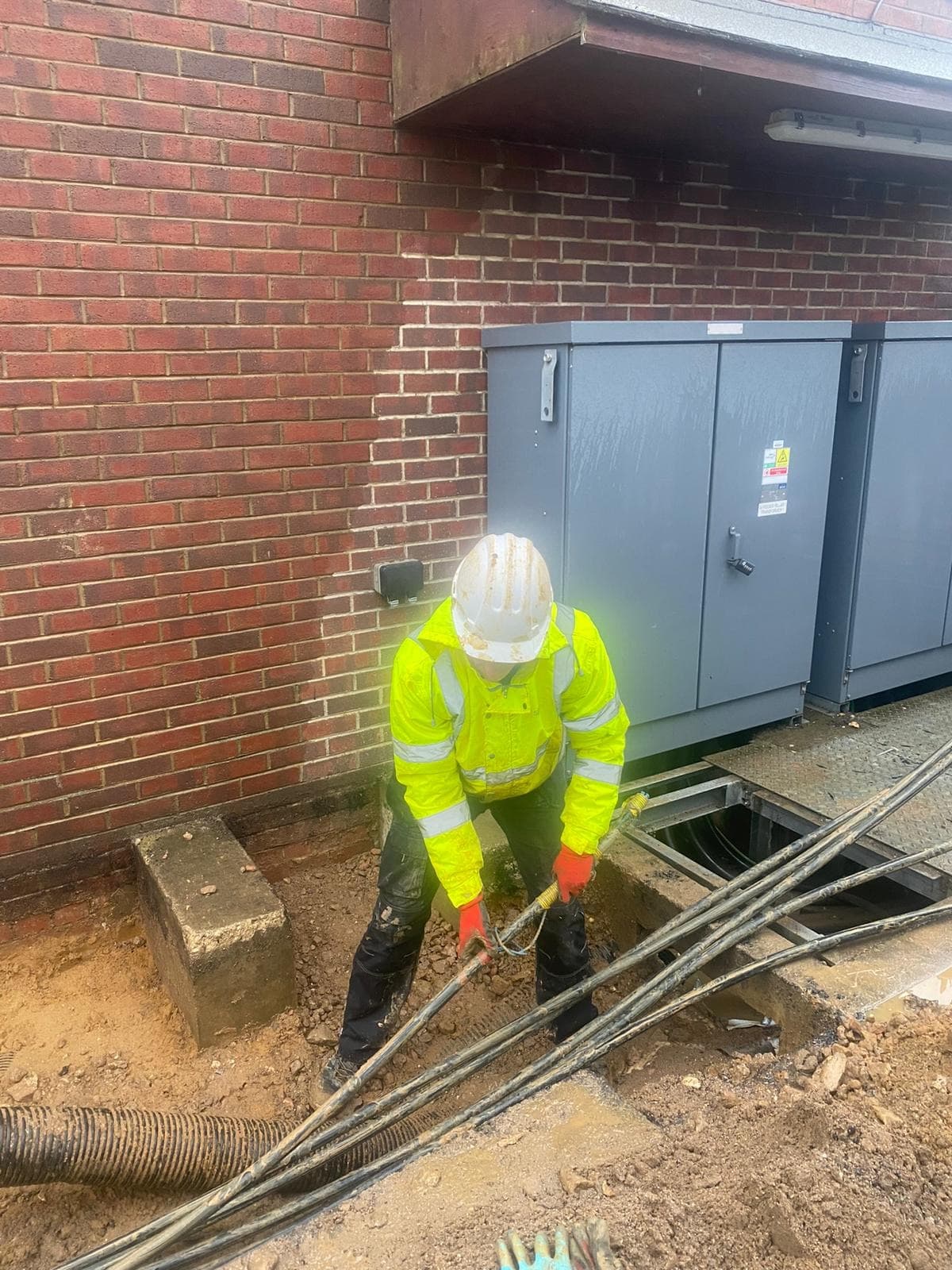 Wirrelec electrician running cables to outdoor cabinets